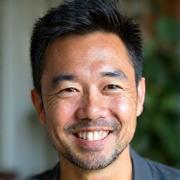 Professional photo of David Chen, an experienced fitness and lifestyle coach