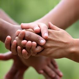 Hands reaching out, symbolizing inclusivity and support